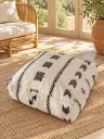 Pouf en Laine et Coton Écru à Motifs Noirs